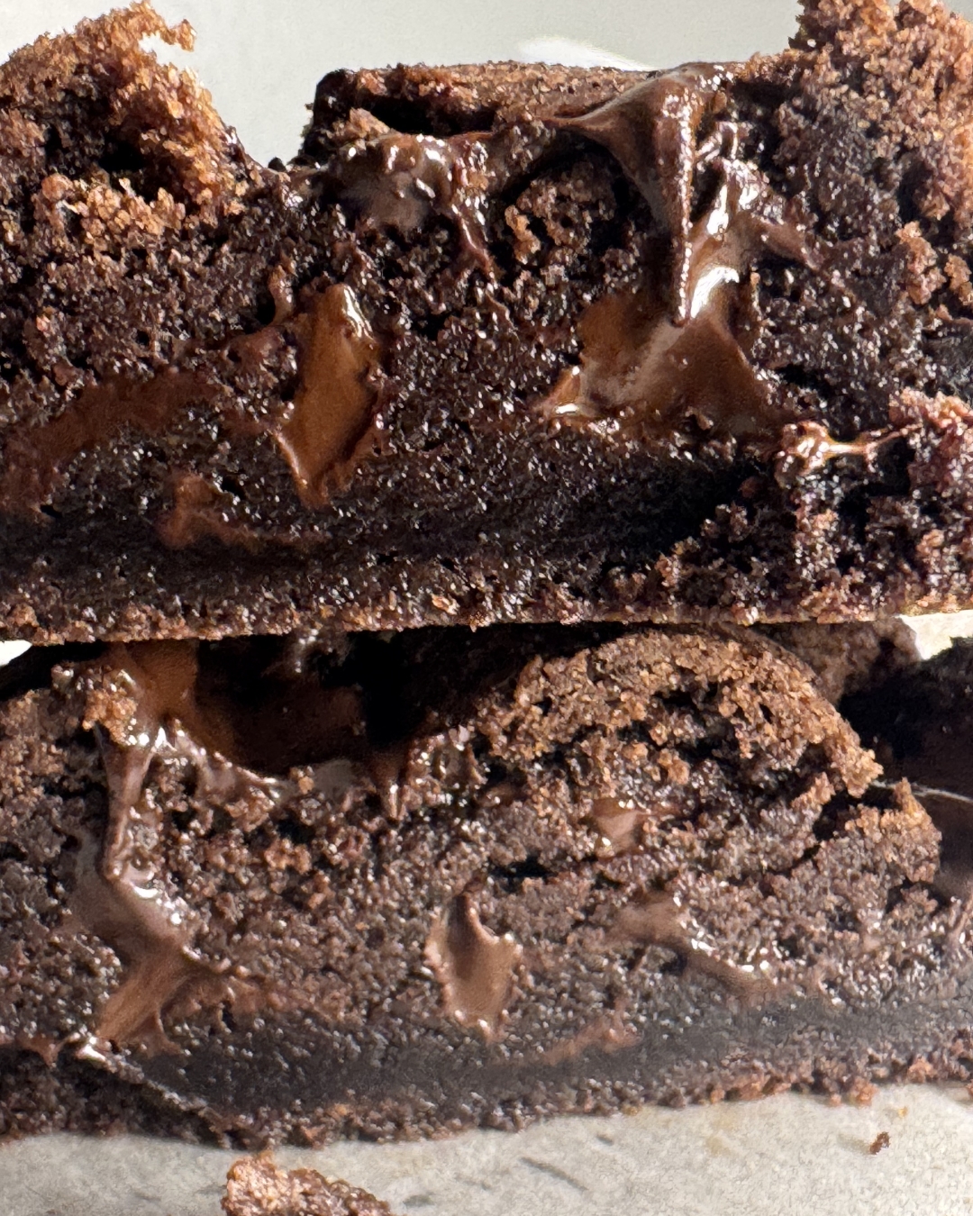 Cross-section of the same cookie — fudgy, molten chocolate interior